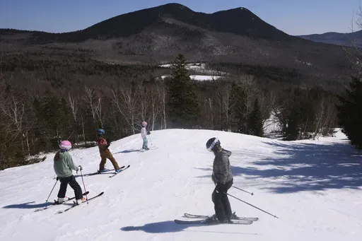 Skiers head down a trail at Black Mountain, Friday, March 14, 2025, in Jackson, N.H. (AP Photo/Charles Krupa)