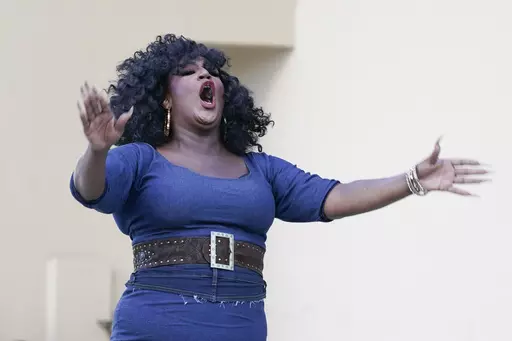Drag queen Angelica Sanchez performs in front of hundreds of people, including immigrants-rights and abortion-rights groups and members of the LGBTQ+ community from across the state, as they take part in a rally and march, May 1, 2023, in Orlando, Fla. A panel of the 11th Circuit Court of Appeals on Wednesday, Oct. 11, 2023, said a ruling prohibiting the enforcement of a new Florida law targeting drag shows will stay in place for the time being, according to a federal appeals court decision. (AP