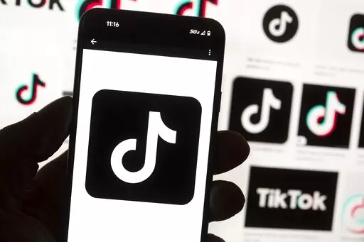 The TikTok logo is seen on a cell phone on Oct. 14, 2022, in Boston. On Thursday, Jan. 12, 2023, Wisconsin became the latest state to ban the use of TikTok on state phones and other devices, a move that comes amid a push for a federal ban and after nearly half of the states nationwide have blocked the popular app. (AP Photo/Michael Dwyer, File)