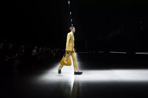 A model wears a creation as part of the men's Gucci Fall-Winter 2024-2025 collection, that was presented in Milan, Italy, Friday, Jan. 12, 2024. (AP Photo/Luca Bruno).