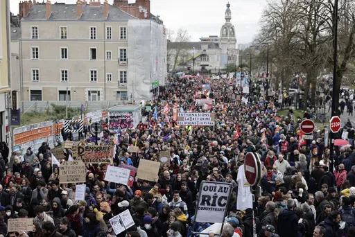 Demonstrators march Thursday, April 6, 2023 in Nantes, western France. Hundreds of thousands of people are expected to fill the streets of France Thursday for the 11th day of nationwide resistance to a government proposal to raise the retirement age from 62 to 64. The furious public reaction to the plan has cornered and weakened French President Emmanuel Macron. (AP Photo/Jeremias Gonzalez)