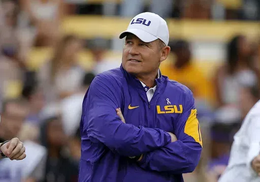 LSU coach Les Miles watches his team warm up before an NCAA college football game against Florida in Baton Rouge, La., Oct. 17, 2015. Former LSU coach Les Miles is suing the university over its decision to vacate 37 victories between 2012 and 2015. The lawsuit filed Monday, June 17, 2024, in federal court in Baton Rouge alleges that LSU never gave Miles a chance to be heard before altering his career record in a way that disqualified him from being considered for induction into the College Footb