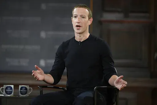Facebook CEO Mark Zuckerberg speaks at Georgetown University in Washington, Thursday, Oct. 17, 2019. Facebook parent Meta is laying off 11,000 people, about 13% of its workforce, as it contends with faltering revenue and broader tech industry woes, Zuckerberg said in a letter to employees Wednesday. (AP Photo/Nick Wass, File)