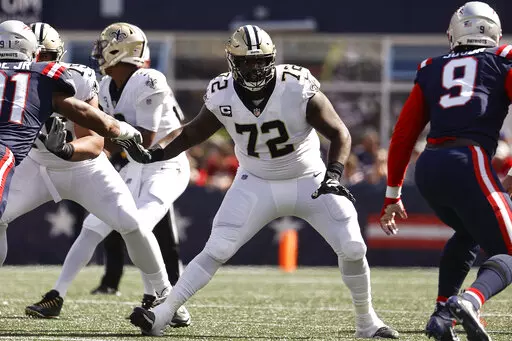 New Orleans Saints offensive tackle Terron Armstead looks to block against the New England Patriots during an NFL football game Sept. 26, 2021, in Foxborough, Mass. Armstead announced Tuesday night, March 22, that he’s signing with the Miami Dolphins. (AP Photo/Winslow Townson, File)