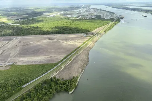 The nearly $3 billion Mid-Barataria Sediment Diversion project along the Mississippi River, intended to stave off coastal land loss in southeastern Louisiana, is seen during a flyover with the environmental coalition group Restore the Mississippi River Delta, Aug. 29, 2024. (AP Photo/Jack Brook)