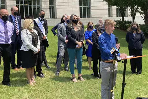 Dylan Brandt speaks at a news conference outside the federal courthouse in Little Rock, Ark., July 21, 2021. Brandt, a teenager, is among several transgender youth and families who are plaintiffs challenging a state law banning gender confirming care for trans minors. A federal judge struck down Arkansas' first-in-the-nation ban on gender-affirming care for children as unconstitutional Tuesday, June 20, 2023. (AP Photo/Andrew DeMillo, File)