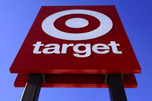 The bullseye logo on a sign outside a Target store is seen on Feb. 28, 2022. Target's first-quarter profit took a big hit from higher costs, despite strong sales growth. Target's results Wednesday, May 18, reflect the pressure on retailers' profits coming from surging inflation and persistent clogs in the supply chain. (AP Photo/Charles Krupa, File)