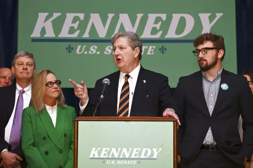 Sen. John Kennedy, joined by his wife, Becky, left, addresses supporters during his election night party, Tuesday, Nov. 8, 2022, at the Lod Cook Alumni Center on the campus of LSU in Baton Rouge, La. (Hilary Scheinuk/The Advocate via AP)