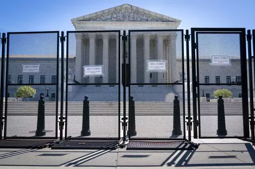 Anti-scaling fencing blocks off the stairs to the Supreme Court, Tuesday, May 10, 2022, in Washington.Abortion legislation facing a Senate test vote would enshrine into federal law the landmark 1973 Roe v. Wade decision that legalized abortion nationwide. Senate Democrats are moving quickly to try to codify the 50-year-old ruling after a leaked draft of a U.S. Supreme Court opinion suggested the court is poised to overturn the case  (AP Photo/Jacquelyn Martin)