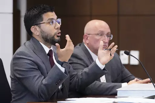 Attorney George Gomez, left, speaks to Judge George D. Strickland as Robert E. Crimo Jr., listens during an appearance at the Lake County Courthouse, Monday, Aug. 7, 2023, in Waukegan, Ill. (AP Photo/Nam Y. Huh, Pool)