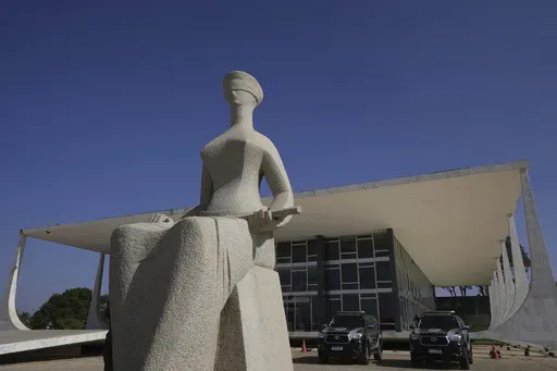 Lady Justice statue, depicting a seated, blindfolded woman holding a sword, stands outside the Supreme Court in Brasilia, Brazil, Sept. 2, 2024. (AP Photo/Eraldo Peres, File)