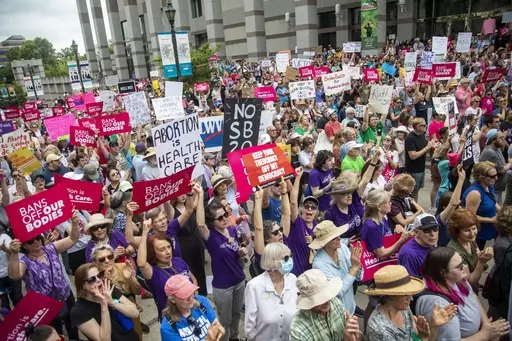 Hundreds of abortion ban veto supporters turned out to watch North Carolina Gov. Roy Cooper sign a veto of the on Bicentennial Mall in Raleigh Saturday, May 19, 2023. Abortion providers in North Carolina filed a federal lawsuit Friday, June 16, 2023, that challenges several provisions of a state law banning most abortions after 12 weeks of pregnancy in the dwindling days before the new restrictions take effect.(Travis Long/The News & Observer via AP, File)