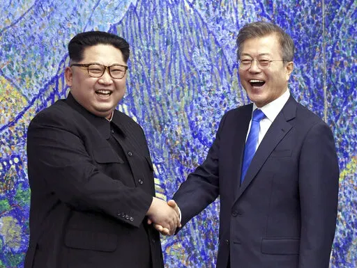 North Korean leader Kim Jong Un, left, poses with South Korean President Moon Jae-in for a photo inside the Peace House at the border village of Panmunjom in Demilitarized Zone, South Korea on April 27, 2018. The leaders of the rival Koreas have exchanged letters expressing hope for improved bilateral relations, which plummeted in the past three years amid a freeze in nuclear negotiations and North Korea's accelerating weapons development. (Korea Summit Press Pool via AP, File)