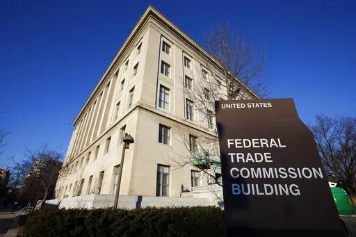 The Federal Trade Commission building in Washington pictured on Jan. 28, 2015. The maker of the popular Fortnite video game will pay $520 million in penalties and refunds to settle complaints revolving around children's privacy and its payment methods that tricked players into making unintended purchases, U.S. federal regulators said Monday, Dec. 19, 2022. (AP Photo/Alex Brandon, File)