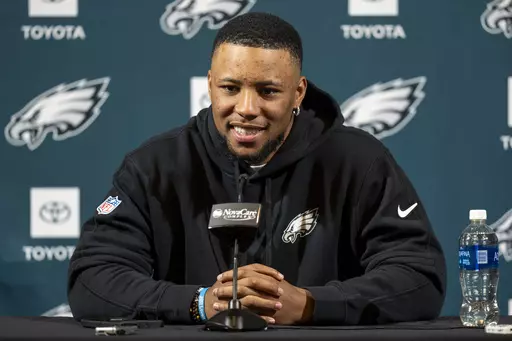 Philadelphia Eagle's Saquon Barkley talks to the media during a press conference after signing with the NFL football team, Thursday, March 14, 2024, in Philadelphia. (AP Photo/Chris Szagola)
