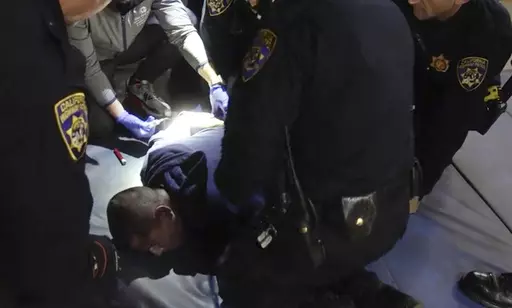 In this image taken from a nearly 18-minute video taken by a California Highway Patrol sergeant, Edward Bronstein, 38, is taken into custody by CHP officers on March 31, 2020, following a traffic stop in Los Angeles. Prosecutors on Wednesday, March 29, 2023, charged seven California Highway Patrol officers and a nurse with involuntary manslaughter in connection with the 2020 in-custody death of Edward Bronstein, who screamed "I can't breathe" while multiple officers restrained him as they tried 