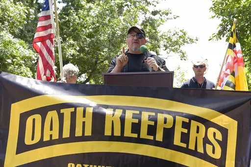 Stewart Rhodes, founder of the Oath Keepers, center, speaks during a rally outside the White House in Washington, June 25, 2017. A new report says that the names of hundreds of U.S. law enforcement officers, elected officials and military members appear on the leaked membership rolls of a far-right extremist group that's accused of playing a key role in the Jan. 6, 2021, riot at the U.S. Capitol. The Anti-Defamation League Center on Extremism pored over more than 38,000 names on leaked Oath Keep