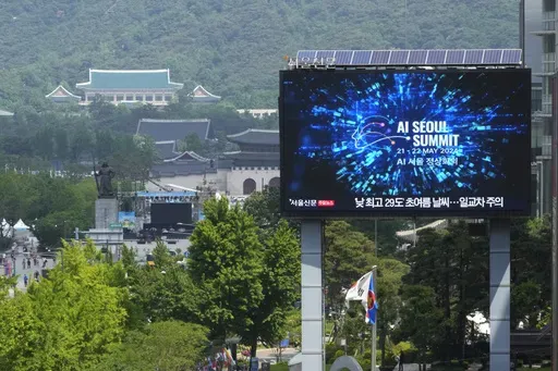 A screen shows an announcement of the AI Seoul Summit in Seoul, South Korea, Tuesday, May 21, 2024. World leaders are expected to adopt a new agreement on artificial intelligence when they gather virtually Tuesday to discuss AI’s potential risks but also ways to promote its benefits and innovation. (AP Photo/Ahn Young-joon)