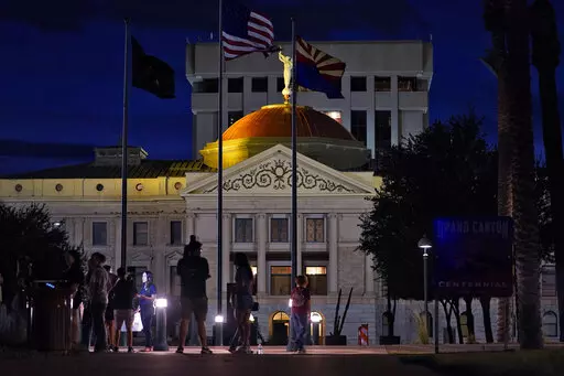 Protesters gather outside the Capitol to voice their dissent with an abortion ruling, Friday, Sept. 23, 2022, in Phoenix. Under an arrangement beginning Monday, Oct. 3, 2022, a Phoenix abortion clinic has come up with a way for patients who can end their pregnancy using a pill to get the medication quickly without running afoul of a resurrected Arizona law that bans most abortions. (AP Photo/Matt York, File)