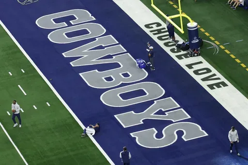 The word's "Choose Love" are displayed in the end zone at AT&T Stadium before a NFL football game between the Washington Commanders and the Dallas Cowboys on Sunday, Jan. 5, 2025, in Arlington, Texas. (AP Photo/Matt Patterson, File)