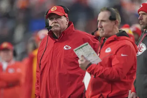 Kansas City Chiefs head coach Andy Reid watches from the sidelines alongside defensive coordinator Steve Spagnuolo, right, during the second half of an NFL football game against the Denver Broncos Sunday, Jan. 5, 2025, in Denver. (AP Photo/David Zalubowski)