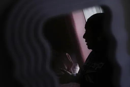 Carmen, who only shared her first name out of fear she could be targeted by immigration officials, is photographed at her apartment Wednesday, Jan. 22, 2025, in the San Francisco Bay Area. (AP Photo/Godofredo A. Vásquez)