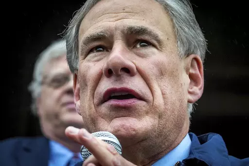 Gov. Greg Abbott speaks on the north steps of the State Capitol to supporters at a Texas Public Policy Foundation Parent Empowerment rally on March 21, 2023, in Austin. Abbott is moving fast to pardon a U.S. Army sergeant convicted in the 2020 killing of an armed protester. Sgt. Daniel Perry faces up to life in prison after being convicted of murder Friday, April 7, in the fatal shooting of 28-year-old Garrett Foster. (Ricardo B. Brazziell/Austin American-Statesman via AP, File)
