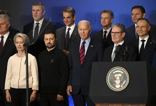 U.S. President Joe Biden, center, with Ukraine's President Volodymyr Zelenskyy, front second left, European Commission President Ursula von der Leyen, front left, Britain's Prime Minister Keir Starmer, front second right, Poland's President Andrzej Duda, right, and other world leaders pose at the launch of the Joint Declaration of Support for Ukrainian Recovery and Reconstruction, on Sept. 25, 2024, in New York. (Leon Neal/Pool Photo via AP, File)