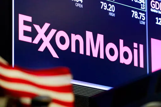 The logo for ExxonMobil appears above a trading post on the floor of the New York Stock Exchange on April 23, 2018. The U.S. government said in a lawsuit filed Thursday, March 2, that ExxonMobil Corp. violated federal law for failing to take sufficient action after five hangman’s nooses were displayed at its facility in Baton Rouge, La. (AP Photo/Richard Drew, File)