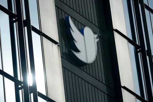 A Twitter logo hangs outside the company's offices in San Francisco, on Dec. 19, 2022. Russia, China and Iran are exploiting recent changes at Twitter to spread disinformation faster and farther. Under new owner Elon Musk, Twitter recently ended its policy of labeling foreign propaganda agencies like RT or Sputnik. (AP Photo/Jeff Chiu, File)
