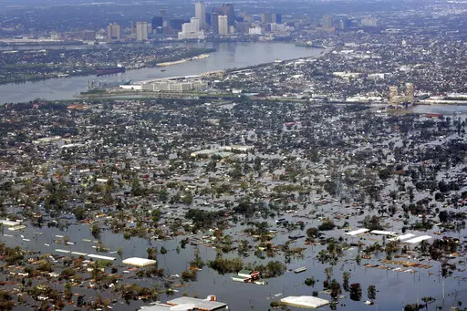 Floodwaters from Hurricane Katrina cover a portion of New Orleans on Aug. 30, 2005. The COVID-19 pandemic greatly accelerated a long-running pattern in giving by foundations and charities for health and natural disasters, a new Chronicle analysis of nine years of data show. (AP Photo/David J. Phillip, File)