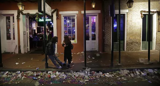 Trash lines the gutter on Bourbon Street, in the early hours of the morning after Mardi Gras, in New Orleans, Feb. 18, 2015. It’s a beloved century-old Carnival season tradition in New Orleans — masked riders on lavish floats fling strings of colorful beads or other trinkets to parade watchers clamoring with outstretched arms. It's all in good fun but it's also a bit of a “plastics disaster,” says Judith Enck, a former Environmental Protection Agency regional administrator and president 