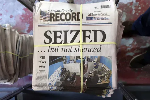 A stack of the Marion County Record sits in the back of the newspaper's building, awaiting unbundling, sorting and distribution, Aug. 16, 2023, in Marion, Kan. The police chief who led a highly criticized raid of the small Kansas newspaper is suspended, the mayor confirmed to The Associated Press on Saturday, Sept. 30. Marion Mayor Dave Mayfield in a text said he suspended Chief Gideon Cody on Thursday, Sept. 28. (AP Photo/John Hanna, File)