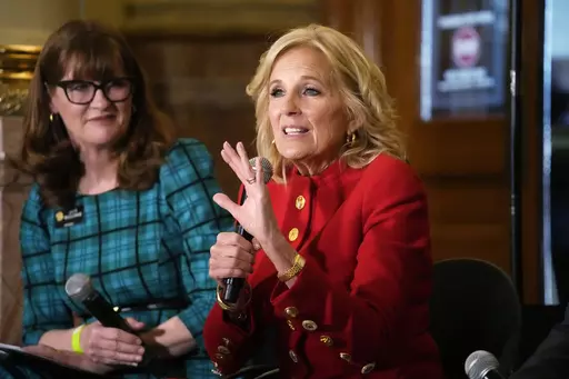 First lady Jill Biden, front, makes a point as Colorado Speaker of the House Julie McCluskie looks on during a stop to attend a roundtable discussion on the federal workforce training program to help community college students earn certificates for entry-level jobs Monday, April 3, 2023, inside the State Capitol in Denver. Both Republican and Democratic state lawmakers were on hand for the first lady's visit, the first of four stops across the country to promote the Biden Administration's effort