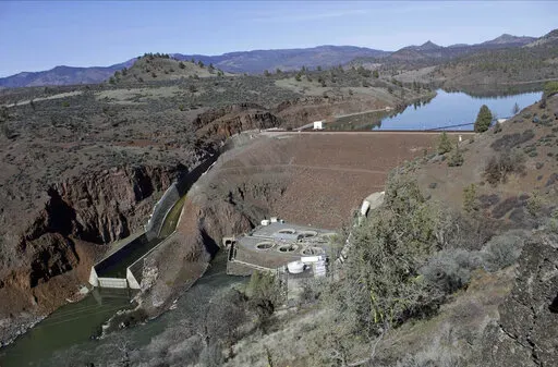 The Iron Gate Dam, powerhouse and spillway is seen on the lower Klamath River near Hornbrook, Calif, on March 3, 2020. The largest dam demolition and river restoration plan in the world could be close to reality Thursday, Nov. 17, 2022, as U.S. regulators vote on a plan to remove four aging hydro-electric structures, reopening hundreds of miles of California river habitat to imperiled salmon. (AP Photo/Gillian Flaccus, File)