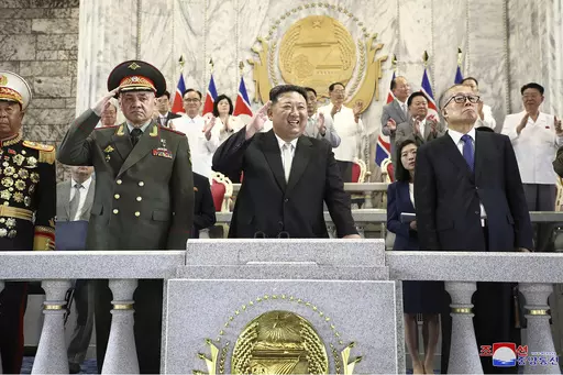In this photo provided by the North Korean government, North Korean leader Kim Jong Un, center, Russian Defense Minister Sergei Shoigu, left, and China's Vice Chairman of the standing committee of the country’s National People’s Congress Li Hongzhong, right, attend a military parade to mark the 70th anniversary of the armistice that halted fighting in the 1950-53 Korean War, on Kim Il Sung Square in Pyongyang, North Korea Thursday, July 27, 2023. Independent journalists were not given access