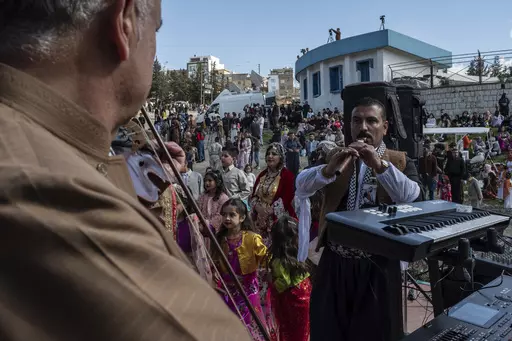 Iraqi Kurds celebrate Nowruz, a Persian New Year, in Sulaimaniyah, Iraq, Monday, March 20, 2023. The Kurdish in Iraq region won de facto self-rule in 1991 when the United States imposed a no-fly zone over it in response to Saddam's brutal repression of Kurdish uprisings. With American invasion 20 years ago much of Iraq fell into chaos, as occupying American forces fought an insurgency and as multiple political and sectarian communities vied to fill the power vacuum left in Baghdad. But the Kurds