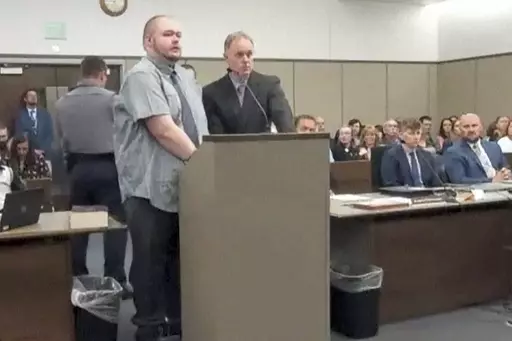 In this image taken from video provided by the Colorado Judicial Branch, Anderson Lee Aldrich, left, the suspect in a mass shooting that killed five people at a Colorado Springs LGBTQ+ nightclub in 2022, appears in court, June 26, 2023, in Colorado Springs, Colo., where they pleaded guilty in the attack. Aldrich was charged with federal hate crimes on Tuesday, Jan. 16, 2024. (Colorado Judicial Branch via AP, File)