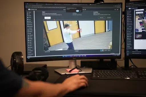 ZeroEyes analyst Mario Hernandez demonstrates the use of artificial intelligence with surveillance cameras to identify visible guns at the company's operations center, Friday, May 10, 2024, in Conshohocken, Pa. (AP Photo/Matt Slocum)