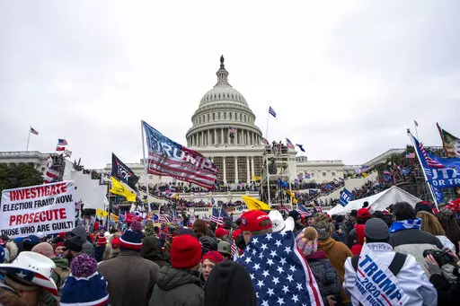 Rioters loyal to President Donald Trump rally at the U.S. Capitol in Washington on Jan. 6, 2021. A new poll shows that many Americans remain pessimistic about the state of their democracy and the way elected officials are chosen. The results of the Associated Press-NORC Center for Public Affairs Research survey come nearly two years after a divisive presidential election spurred false claims of widespread fraud and a violent attack on the U.S. Capitol. (AP Photo/Jose Luis Magana, File)