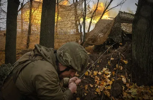 A serviceman of the 13th Brigade of the National Guard of Ukraine fires Giatsint-B gun towards Russian positions near Kharkiv, Ukraine, on Nov. 6, 2024. (AP Photo/Efrem Lukatsky, File)