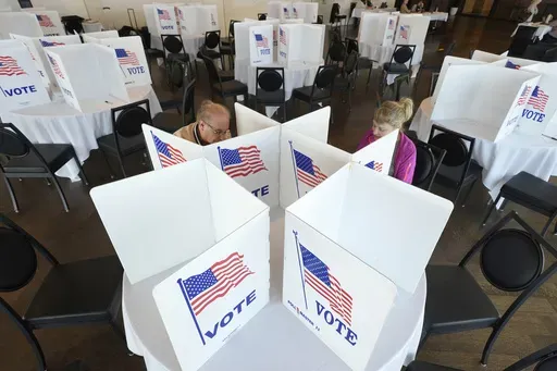Voters fill out their ballots for the Michigan primary election, Feb. 27, 2024, in Grosse Pointe Farms, Mich. (AP Photo/Paul Sancya, File)