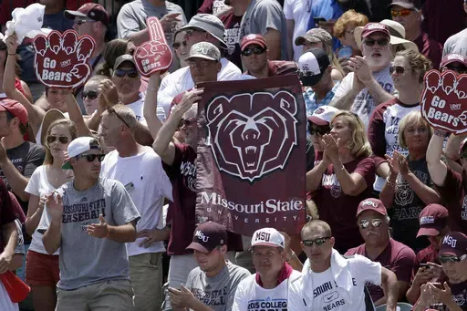 Fans hold Missouri State flags during a tournament in Fayetteville, Ark., Sunday, June 7, 2015. Missouri State is moving up to the highest tier of Division I college football and joining Conference USA in 2025. (AP Photo/Danny Johnston, File)