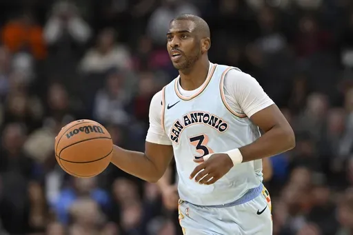 San Antonio Spurs' Chris Paul runs upcourt during the first half of an NBA basketball game against the New Orleans Pelicans, Sunday, Dec. 8, 2024, in San Antonio. (AP Photo/Darren Abate)