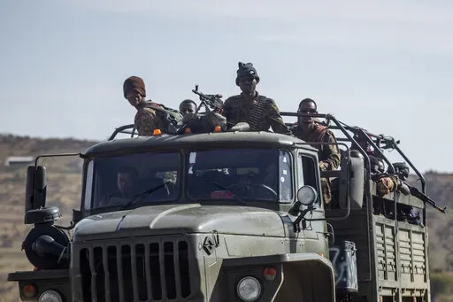 Ethiopian government soldiers ride in the back of a truck on a road near Agula, north of Mekele, in the Tigray region of northern Ethiopia on May 8, 2021. Authorities in Ethiopia's northern Tigray region alleged Wednesday, Aug. 24, 2022 that Ethiopia's military launched a "large-scale" offensive for the first time in a year, while Ethiopia's military spokesman did not immediately respond to questions. (AP Photo/Ben Curtis, File)
