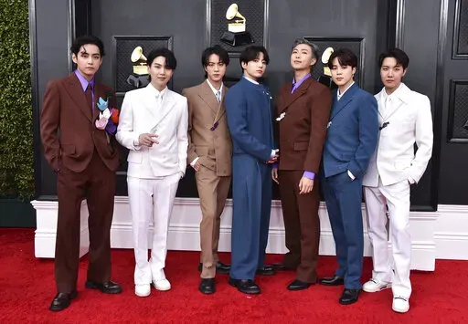 BTS arrives at the 64th Annual Grammy Awards on April 3, 2022, in Las Vegas. The group says they are taking time to focus on solo projects. The seven-member group with hits like “Butter” and “Dynamite” talked about their future in a video posted June 14, celebrating the nine year anniversary of their debut release.  (Photo by Jordan Strauss/Invision/AP, File)
