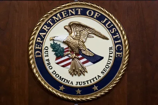 The seal of the Department of Justice, Aug. 1, 2023, at the Department of Justice in Washington. (AP Photo/J. Scott Applewhite, File)