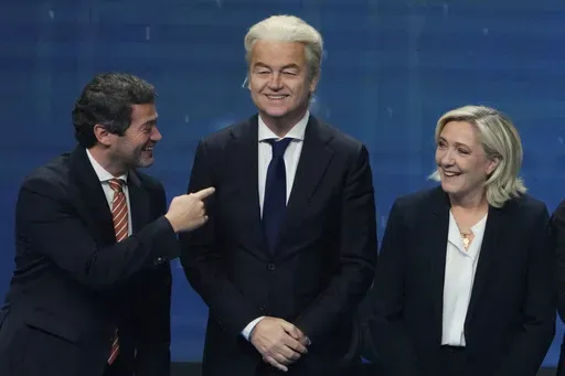 Andre Ventura, leader of Portugal populist right wing party Chega, left, speaks with Dutch far right wing politician Geert Wilders, center and French far-right leader Marine Le Pen during the far-right Patriots for Europe summit in Madrid, Spain, Saturday, Feb. 8, 2025. (AP Photo/Paul White, File)