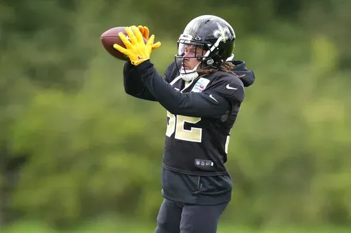 New Orleans Saints safety Tyrann Mathieu catches the ball during an NFL practice session at the London Irish rugby team training ground in Sunbury-on-Thames near London, Wednesday, Sept. 28, 2022 ahead of the NFL game against Minnesota Vikings at the Tottenham Hotspur stadium on Sunday. (AP Photo/Kirsty Wigglesworth)