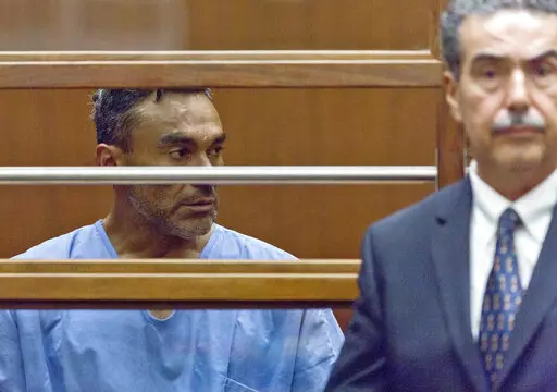 Ramon Escobar, with an unidentified attorney, appears at a hearing in Los Angeles County Superior Court on Sept. 26, 2018. Escobar who pleaded guilty to a series of Southern California attacks that killed five men and injured seven others was sentenced Friday, May 6, 2022, to life in prison without possibility of parole. Ramon Escobar, 50, received multiple life sentences after entering guilty pleas to murder with special circumstances and attempted murder. (AP Photo Damian Dovarganes, File)